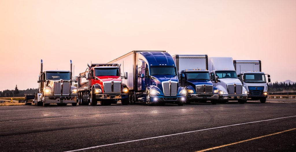 Family photo lineup of Kenworth Trucks. 2027 Emissions